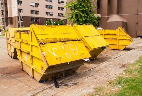 Waste removal crew preparing equipment at a commercial site